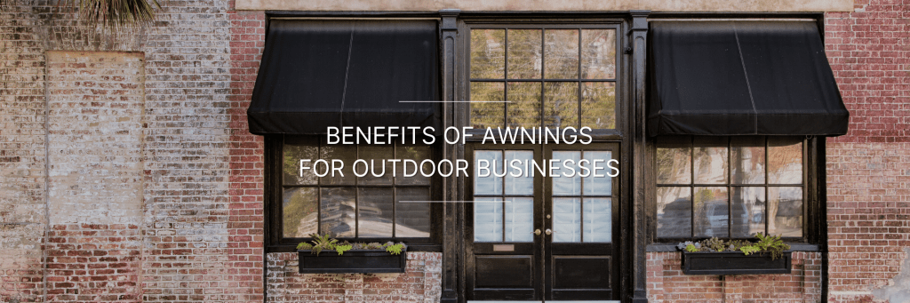 Image of a brick building with black awnings and large windows, showcasing the benefits of awnings for outdoor business