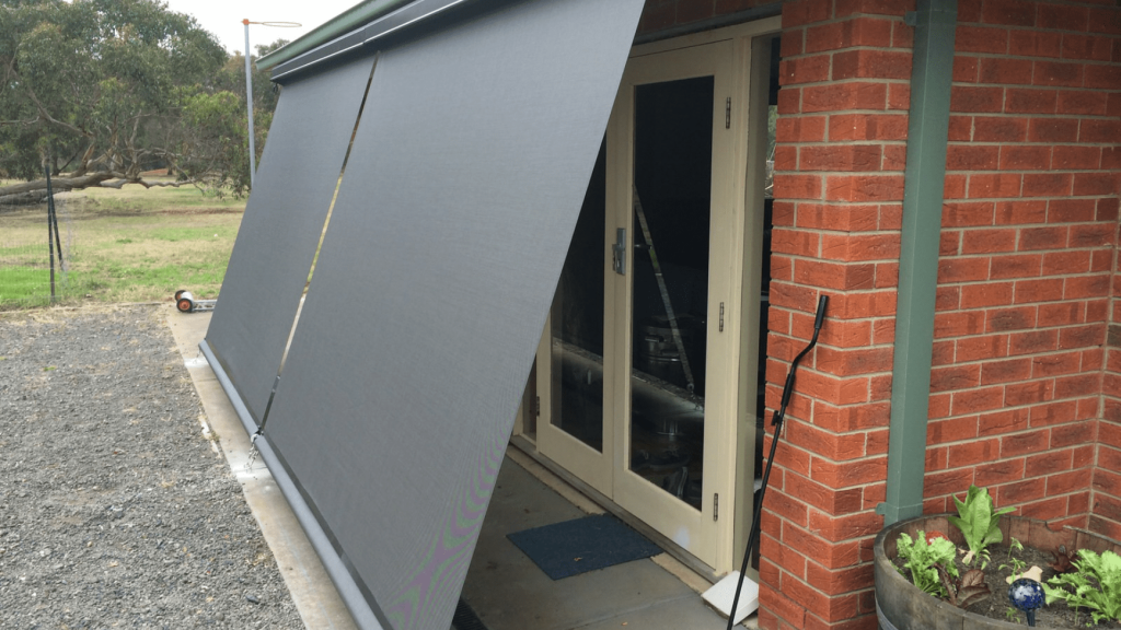 A drop awning providing shade over a door