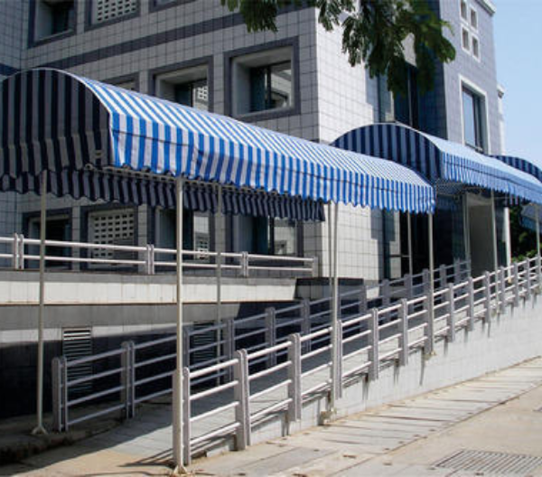 A blue and white striped tunnel awning