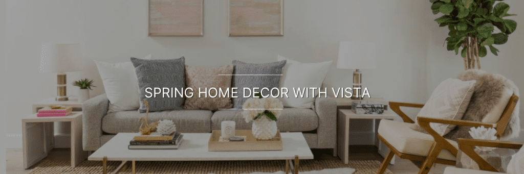 Stylish living room featuring a gray sofa, decorative pillows, wooden side tables, and a leafy plant. Bright and inviting atmosphere.