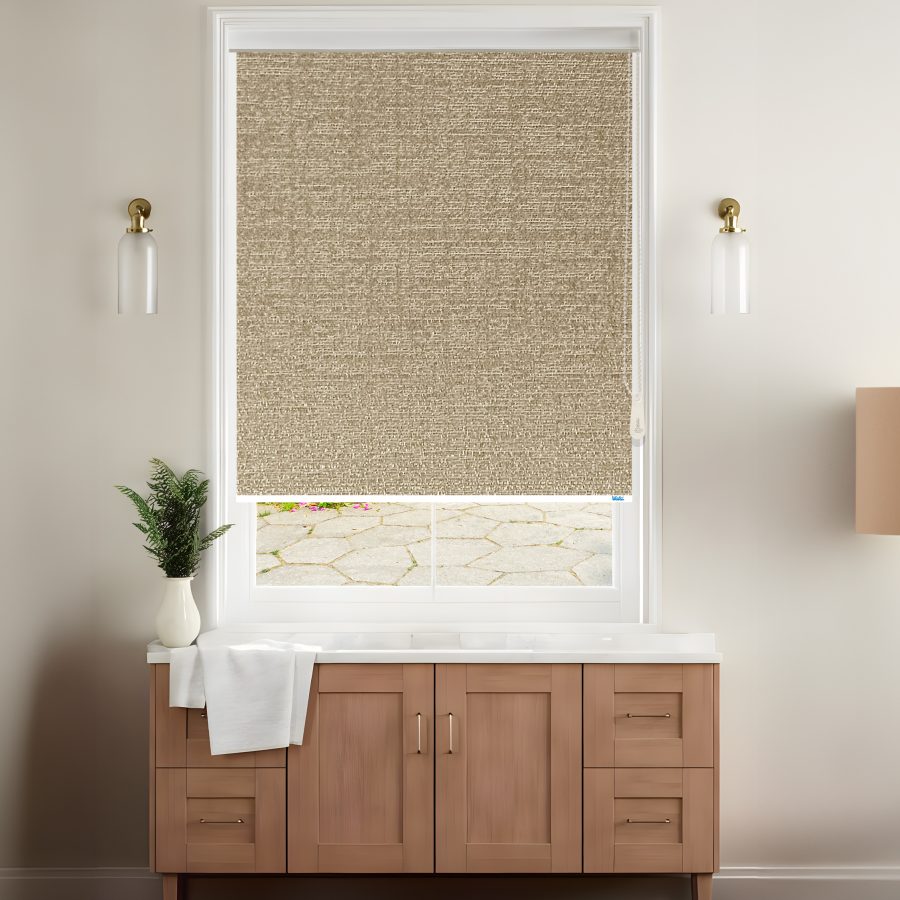 A stylish room features a beige textured roller blinds covering a window with a view of a stone patio, complemented by modern decor.