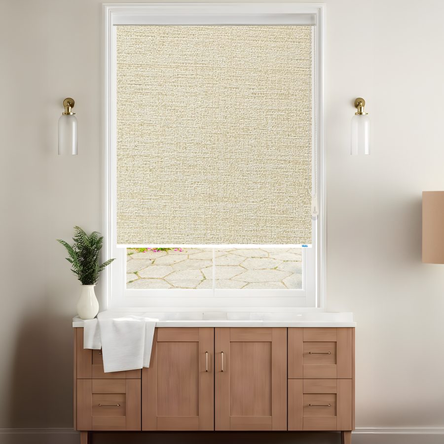 A stylish room features a light beige roller blinds covering a window with a view of a stone patio, complemented by modern decor.