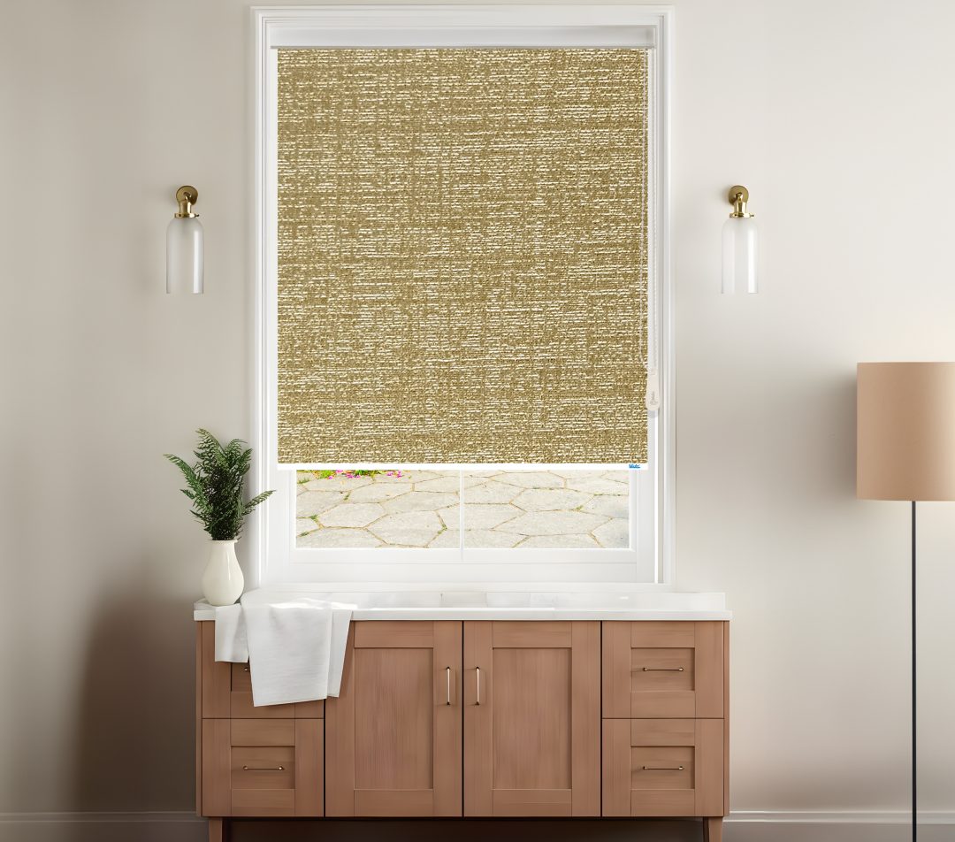 A stylish room features a dark beige textured roller blinds covering a window with a view of a stone patio, complemented by modern decor.