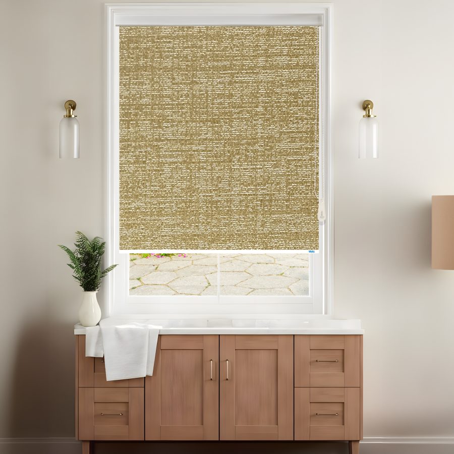 A stylish room features a dark beige textured roller blinds covering a window with a view of a stone patio, complemented by modern decor.