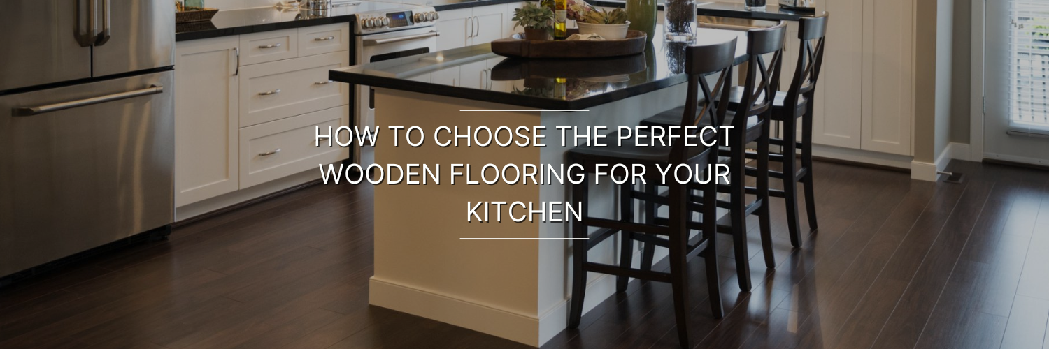 Modern kitchen with dark wooden flooring, white cabinetry, stainless steel appliances, and a dining area with wooden stools.