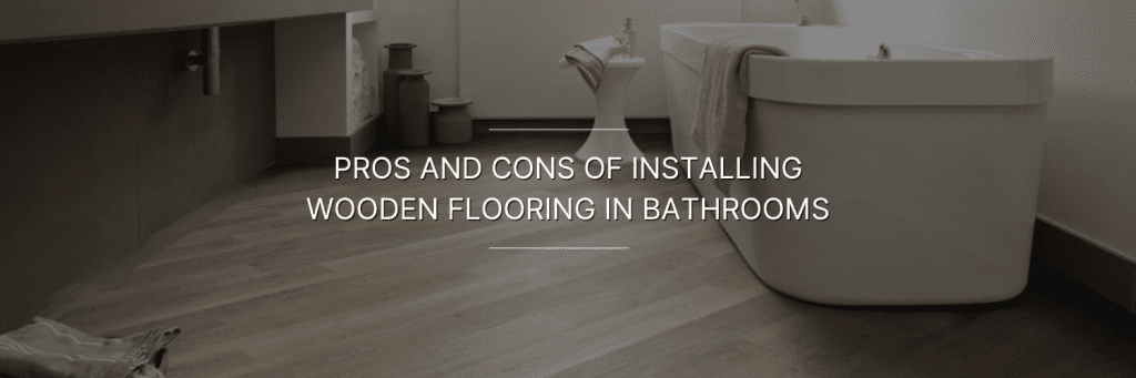 Stylish bathroom featuring wooden flooring, with a freestanding tub and modern decor, highlighting the pros and cons of wood in bathrooms.