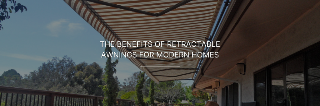 A stylish retractable awning extends over a modern home patio, providing shade against bright sunlight, surrounded by lush greenery.
