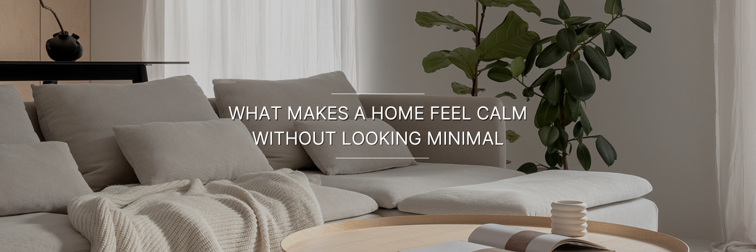 A cozy living room scene featuring a plush sectional sofa with soft cushions, natural light, and a decorative plant, conveying a calming ambiance.