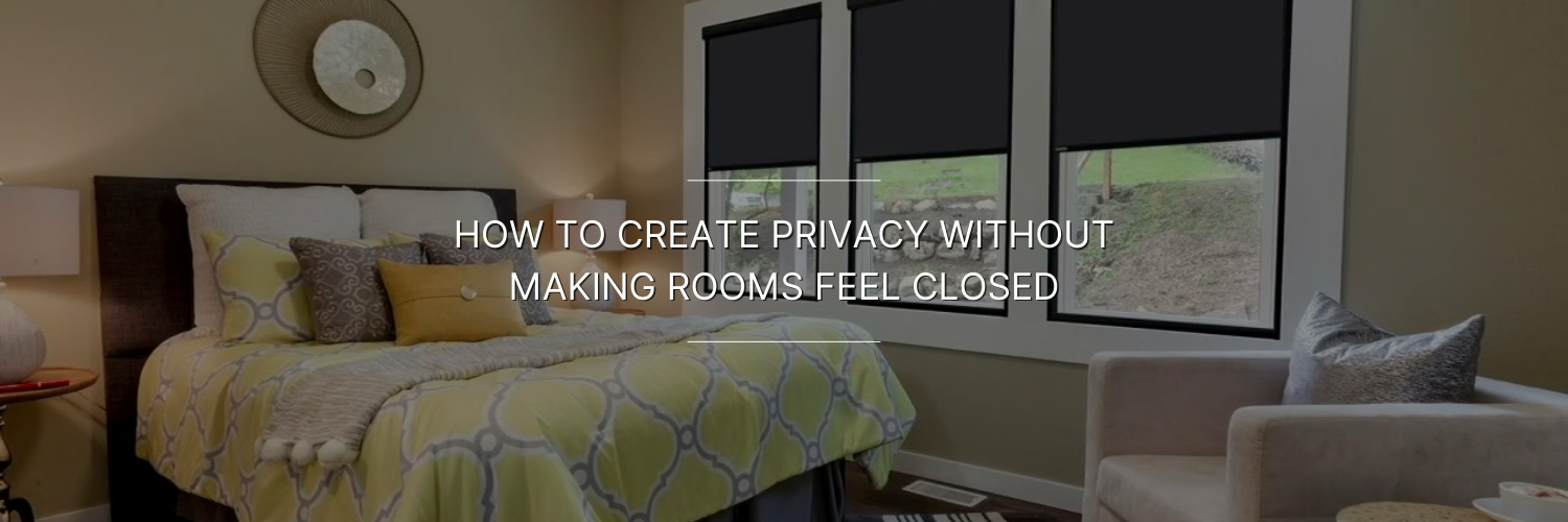 Cozy bedroom featuring a bed with colorful pillows and rolling black window shades, promoting privacy without closing off space.