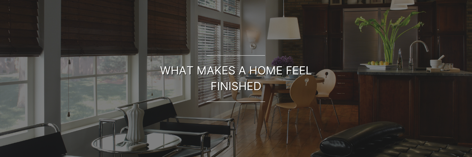 Modern, stylish living space featuring large windows, wooden blinds, and sleek furniture, with a warm, inviting atmosphere.