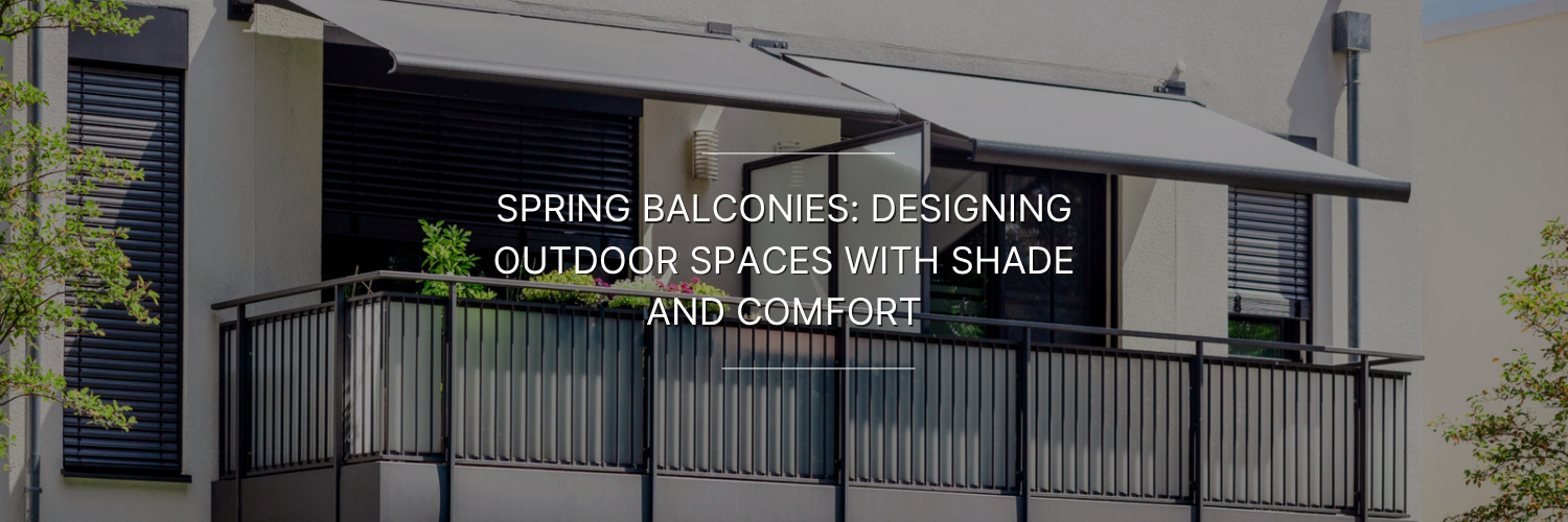 Modern apartment balcony with black railing, retractable gray awning for shade, and potted plants along the edge.