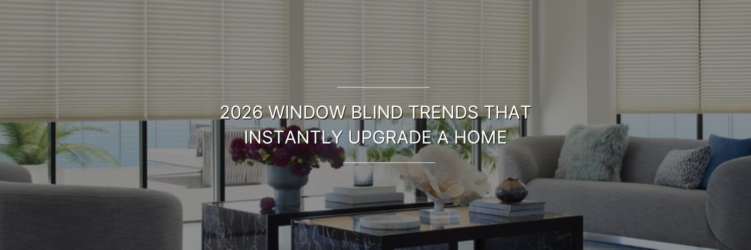Modern living room with sleek furniture, marble coffee table, and trendy window blinds. Text overlay: "2026 Window Blind Trends That Instantly Upgrade a Home.