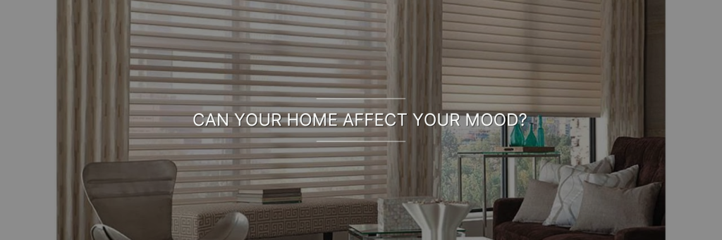 Modern living room with neutral-colored furniture, large windows covered by horizontal blinds, and the text "CAN YOUR HOME AFFECT YOUR MOOD?" displayed across the image.