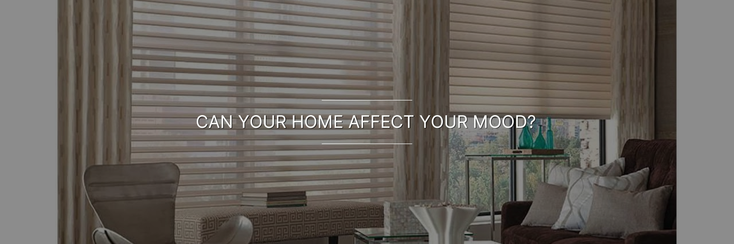 Modern living room with neutral-colored furniture, large windows covered by horizontal blinds, and the text "CAN YOUR HOME AFFECT YOUR MOOD?" displayed across the image.