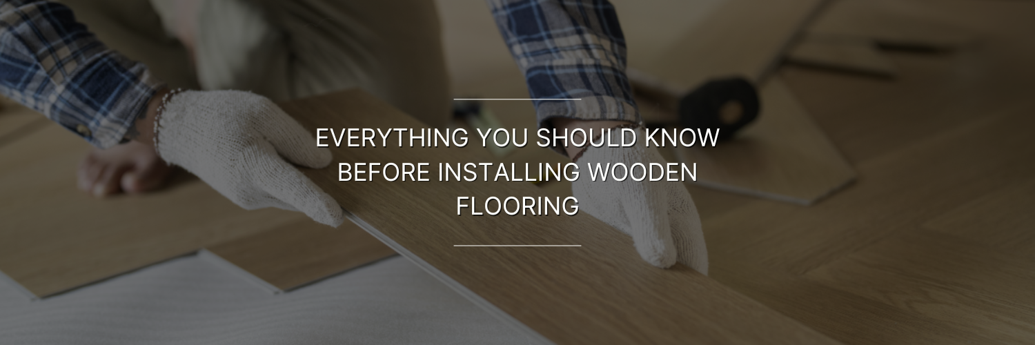Person wearing gloves installing wooden flooring planks on a floor, with text overlay about wooden flooring installation tips.